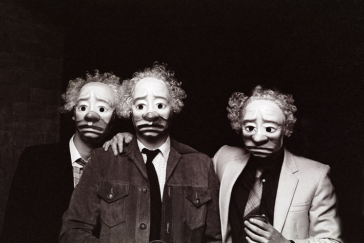 Three lads in clown masks